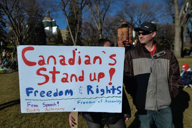 Standing Together Against Mandatory Vaccines Protest In Edmonton A woman holds a placard with words Canadians Stand Up! Freedom and Rights . Hundreds of Albertans gathered during Standing Together Against Mandatory Vaccines protest against forced vaccine mandates at the Alberta Legislative Grounds, joining a sit-in camp by members of the First Nations and their supporters who protest since the beginnin of October, to raise awareness of issues facing First Nations communities in Canada. On Sunday, 24 August 2021, in Alberta Legislature Grounds, Edmonton, Alberta, Canada. Edmonton Canada  Copyright: xArturxWidakx widak-standing211024_npBeF