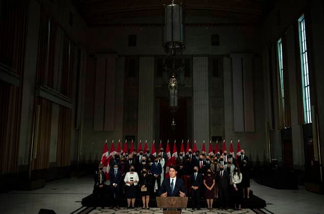 October 26, 2021, Ottawa, ON, CAN: Prime Minister Justin Trudeau stands in front of his newly sworn in federal cabinet during a news conference in Ottawa, on Tuesday, Oct. 26, 2021. Ottawa CAN  - ZUMAc35_ 20211026_zaf_c35_220 Copyright: xJustinxTangx