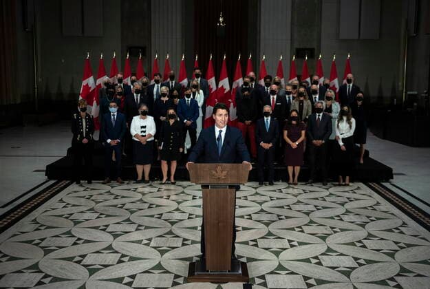 October 26, 2021, Ottawa, ON, CAN: The federal cabinet stands behind Prime Minister Justin Trudeau as he speaks at a news conference after a swearing in ceremony, in Ottawa, on Tuesday, Oct. 26, 2021. Ottawa CAN  - ZUMAc35_ 20211026_zaf_c35_242 Copyright: xJustinxTangx