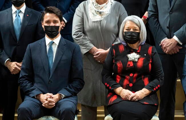 October 26, 2021, Ottawa, ON, CAN: Prime Minister Justin Trudeau is seated beside Gov. Gen. Mary May Simon as they pose for a group photo with members of the federal cabinet after a swearing in ceremony at Rideau Hall in Ottawa, on Tuesday, Oct. 26, 2021. Ottawa CAN  - ZUMAc35_ 20211026_zaf_c35_249 Copyright: xJustinxTangx