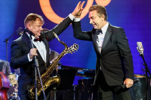 MOSCOW, RUSSIA - OCTOBER 27, 2021: Russian jazz saxophonist Igor Butman (L) and singer Valery Syutkin perform during a gala concert marking Butmanâ€™s 60th birthday at the State Kremlin Palace. The concert is held in the COVID-free format. Valery Sharifulin TASS  TS115F63