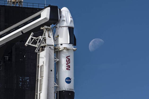 A SpaceX Falcon 9 rocket with the company s Crew Dragon spacecraft onboard is seen after being raised into a vertical position on the launch pad at Launch Complex 39A as preparations continue for the Crew-3 mission, on October 27, 2021, at NASA s Kennedy Space Center in Florida. NASA s SpaceX Crew-3 mission is the third crew rotation mission of the SpaceX Crew Dragon spacecraft and Falcon 9 rocket to the International Space Station as part of the agency s Commercial Crew Program. NASA astronauts Raja Chari, Tom Marshburn, Kayla Barron, and ESA (European Space Agency) astronaut Matthias Maurer are scheduled to launch on October 31 at 2:21 a.m. ET, from Launch Complex 39A at the Kennedy Space Center.  WAX2021102705 SPACEX