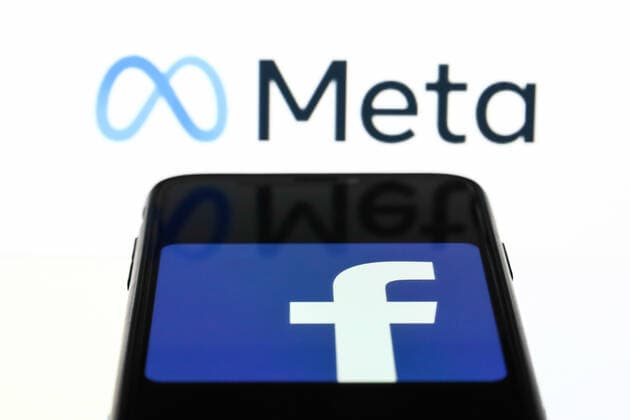 Meta Announced As The New Name Of Facebook Company Meta logo displayed on a laptop screen and Facebook app logo displayed on a phone screen are seen in this illustration photo taken in Krakow, Poland on October 28, 2021. Mark Zuckerberg announced during Facebook Connect event that the new name of Facebook company will be Meta Krakow Poland  Copyright: xJakubxPorzyckix porzycki-metaanno211028_npAn7