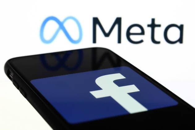 Meta Announced As The New Name Of Facebook Company Meta logo displayed on a laptop screen and Facebook app logo displayed on a phone screen are seen in this illustration photo taken in Krakow, Poland on October 28, 2021. Mark Zuckerberg announced during Facebook Connect event that the new name of Facebook company will be Meta Krakow Poland  Copyright: xJakubxPorzyckix porzycki-metaanno211028_npTBy