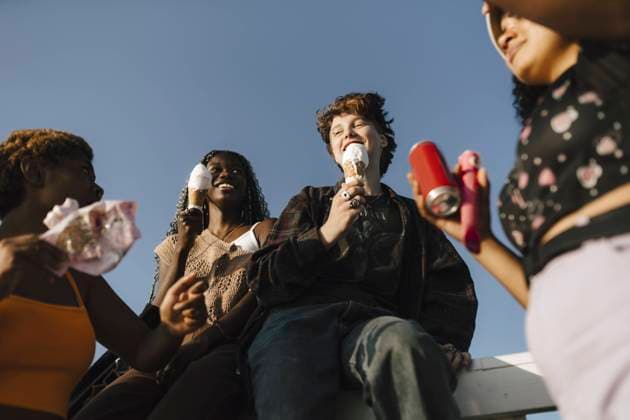 Smiling multiracial friends with ice creams on sunny day Sweden, Malmo, model released Copyright: xMaskotx , MA89711