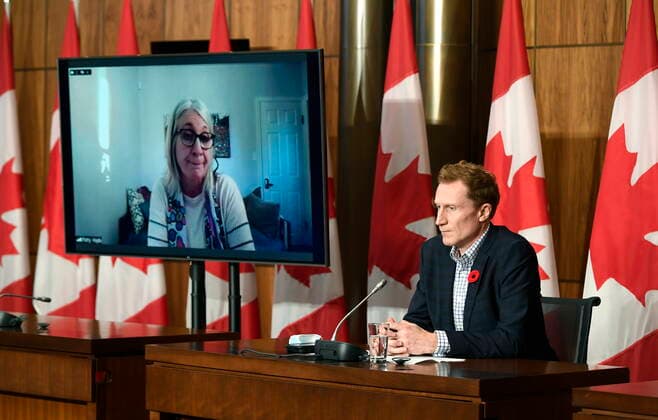 October 29, 2021, Ottawa, ON, CAN: Minister of Crown-Indigenous Relations Marc Miller, right, listens as Minister of Indigenous Services Patty Hajdu, appearing via video conference at left, speaks during a news conference regarding the order from the Canadian Human Rights Tribunal to compensate Indigenous children and their families, in Ottawa, on Friday, Oct. 29, 2021. Ottawa CAN - ZUMAc35_ 20211029_zaf_c35_147 Copyright: xJustinxTangx