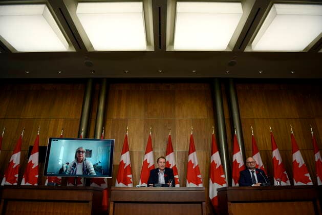 October 29, 2021, Ottawa, ON, CAN: Minister of Crown-Indigenous Relations Marc Miller, centre, Minister of Justice David Lametti and and Minister of Indigenous Services Patty Hajdu, appearing via video conference at left, participate in a news conference regarding the order from the Canadian Human Rights Tribunal to compensate Indigenous children and their families, in Ottawa, on Friday, Oct. 29, 2021. Ottawa CAN - ZUMAc35_ 20211029_zaf_c35_153 Copyright: xJustinxTangx