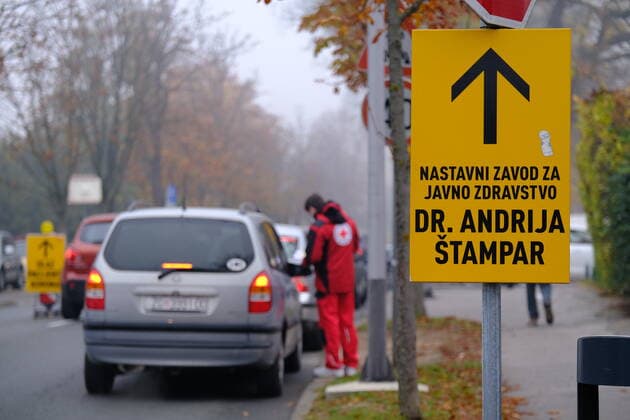 Croatia on a peak of 4th COVID-19 wave A health worker speaks with a person inside a vehicle at Andrija Stampar Teaching Institute of Public Health COVID-19 drive-through testing in Zagreb, Croatia on October 30, 2021. The director of the Croatian Institute of Public Health, Krunoslav Capak hopes that Croatia is on a peak of 4th COVID-19 wave. SlavenxBranislavxBabic PIXSELL