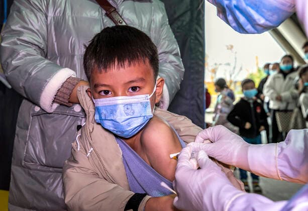 (211101) -- QIANXI, Nov. 1, 2021 -- A young student receives a dose of COVID-19 vaccine at a vaccination site in Qianxi City, southwest China s Guizhou Province, Nov. 1, 2021. Qianxi City on Monday launched a COVID-19 vaccination campaign for children aged 3 to 11. (Photo by Xinhua) CHINA-GUIZHOU-QIANXI-CHILDREN-COVID-19-VACCINATION (CN) FanxHui 