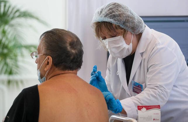 MOSCOW, RUSSIA â€“ NOVEMBER 1, 2021: A at a COVID-19 mobile vaccination site at the GUM department store. From October 28 to November 7, the Moscow authorities have introduced paid non-working days to limit the spread of the novel coronavirus disease (COVID-19). Shopping malls, entertainment establishments, fitness centres and non-essential retail stores will suspend their operation and cafes and restaurants will only provide takeaway and food delivery services during this time. Sergei Fadeichev TASS  TS11670C