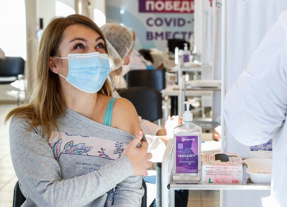MOSCOW, RUSSIA â€“ NOVEMBER 1, 2021: A at a COVID-19 mobile vaccination site at the GUM department store. From October 28 to November 7, the Moscow authorities have introduced paid non-working days to limit the spread of the novel coronavirus disease (COVID-19). Shopping malls, entertainment establishments, fitness centres and non-essential retail stores will suspend their operation and cafes and restaurants will only provide takeaway and food delivery services during this time. Sergei Fadeichev TASS  TS11670B