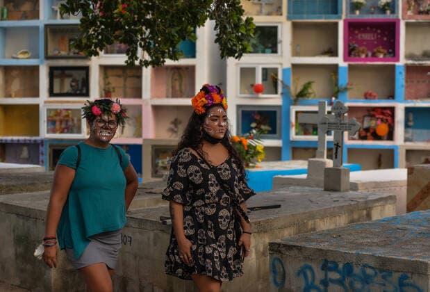 All Saints Day Celebrations In Playa Del Carmen Two women with faces covered with calaveras makeup walk in the municipal cemetery of Playa del Carmen. All Saints Day in Mexico coincides with the first day of the Day of the Dead (Dia de Muertos) celebration. It commemorates children who have died (Dia de los Inocentes) and the second day celebrates all deceased adults. In 2008, the tradition was inscribed in the Representative List of the Intangible Cultural Heritage of Humanity by UNESCO. On Monday, 1 November 2021, in Playa Del Carmen, Quintana Roo, Mexico. Playa Del Carmen Mexico  Copyright: xArturxWidakx widak-allsaint211101_npyuh