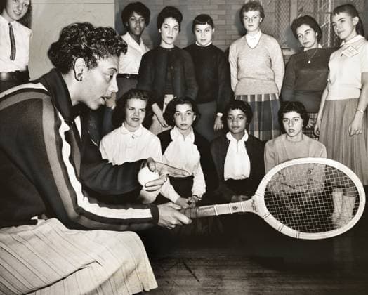 Althea Gibson, U.S. and Wimbledon tennis champion, with female students at Tennis Clinic, Midwood High School, Brooklyn, New York, USA, Ed Ford, New York World-Telegram and the Sun Newspaper Photograph Collection, December 1957  Copyright: xCircaxImagesx ghi-circa10350