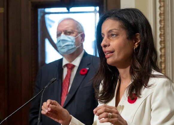 November 2, 2021, QUEBEC, PQ, Canada: Quebec Liberal Leader Dominique Anglade responds to reporters questions over the dismissal of MNA Marie Montpetit from the Liberal caucus, Tuesday, November 2, 2021 at the legislature in Quebec City. Caucus president Pierre Arcand, left, looks on. QUEBEC Canada  - ZUMAc35_ 20211102_zaf_c35_020 Copyright: xJacquesxBoissinotx