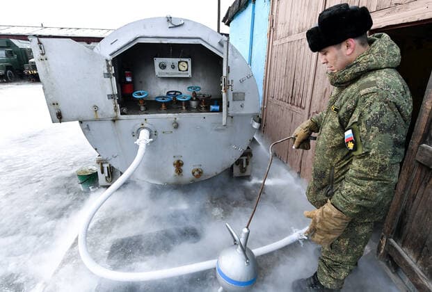 MURMANSK REGION, RUSSIA â€“ NOVEMBER 2, 2021: Russia s Northern Fleet naval aviation serviceman at an oxygen producing station. Liquefied oxygen is stored and transported in special containers. The Northern Fleet supplies liquefied oxygen to hospitals for COVID-19 patients where there is oxygen shortage. The Northern Fleet has enough oxygen to supply its naval aviation and to help civilian healthcare workers. Lev Fedoseyev TASS  TS11695E