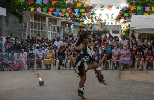 Day Of The Dead In Playa Del Carmen A show by a local folk group related to the Day of the Dead (in Spanish: Dia de Muertos) in the municipal cemetery of Playa del Carmen. All Saints Day in Mexico coincides with the first day of the Day of the Dead (Dia de Muertos) celebration. It commemorates children who have died (Dia de los Inocentes) and the second day celebrates all deceased adults. In 2008, the tradition was inscribed in the Representative List of the Intangible Cultural Heritage of Humanity by UNESCO. On Tuesday, 2 November 2021, in Playa Del Carmen, Quintana Roo, Mexico. Playa Del Carmen Mexico  Copyright: xArturxWidakx widak-dayofthe211102_npLsM