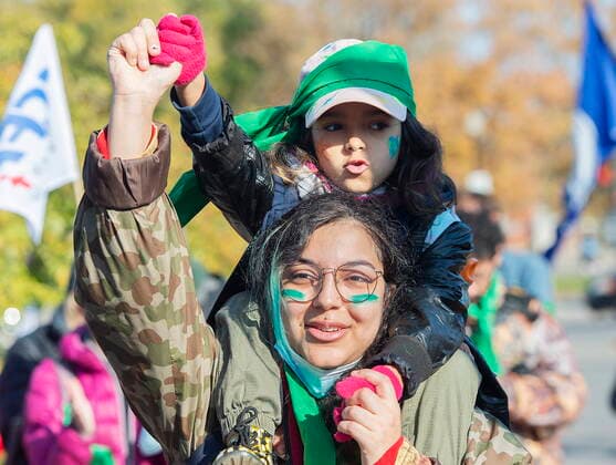 November 6, 2021, Montreal, PQ, Canada: A woman and child take part in a climate change protest in Montreal, Saturday, Nov. 6, 2021. Montreal Canada  - ZUMAc35_ 20211106_zaf_c35_006 Copyright: xGrahamxHughesx