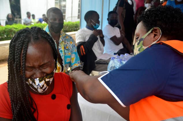 (211106) -- KAMPALA, Nov. 6, 2021 -- A woman receives a dose of the COVID-19 vaccine during mass vaccination in Kampala, Uganda, on Nov. 6, 2021. (Photo by Xinhua) UGANDA-KAMPALA-COVID-19-MASS VACCINATION NicholasxKajoba 