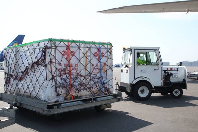 (211108) -- KIGALI, Nov. 8, 2021 -- A new batch of Sinopharm COVID-19 vaccine donated by the Chinese government arrives at Kigali International Airport in Kigali, Rwanda, Nov. 7, 2021. Rwanda on Sunday received 300,000 doses of Sinopharm COVID-19 vaccine donated by the Chinese government, the second batch donated by China so far. ) RWANDA-KIGALI-CHINESE VACCINE-ARRIVAL JixLi 