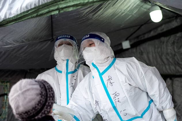 (211108) -- XINING, Nov. 8, 2021 -- A medical worker takes a swab sample from a citizen for nucleic acid test at a testing site in Xining, northwest China s Qinghai Province, Nov. 8, 2021. Xining started its second round of mass nucleic acid testing at 9 a.m. on Monday. As of Nov. 7, Xining finished the first round of testing, and all swab samples from 1,448,000 citizens came back negative. ) CHINA-QINGHAI-XINING-COVID-19-NUCLEIC ACID-TEST (CN) WuxGang 