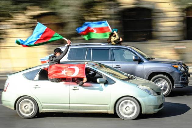 Azerbaijan Armenia Nagorno-Karabakh Conflict Anniversary 6691413 08.11.2021 People drive their cars decorated with Azerbaijani flags during celebrations marking the anniversary of the end of the 2020 military conflict over the Nagorno-Karabakh region, in Baku, Azerbaijan. Azerbaijan on Monday is celebrating the one-year anniversary of the capture of the city of Shusha, the battle that led to its defeat of Armenia in last year?s war. Murad Orujov Sputnik Baku Azerbaijan  Copyright: xMuradxOrujovx