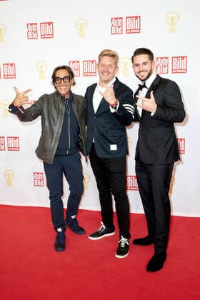 The Golden Steering Wheel 2021 Antonino Labate Director of Strategy, Business Development Operation CUPRA , Wayne Griffiths Chairman of the Board SEAT S A and racing driver Daniel Abt on the red carpet at the Golden Steering Wheel award ceremony at the Axel Springer Tower in Berlin Copyright: xEventpressxGolejewskix