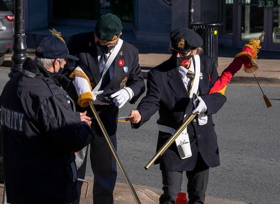 November 11, 2021, Halifax, NS, Canada: Members of the colour guard show their vaccination records as they arrive for Remembrance Day ceremonies at the Grand Parade in Halifax on Thursday, Nov. 11, 2021. Halifax Canada  - ZUMAc35_ 20211111_zaf_c35_026 Copyright: xAndrewxVaughanx