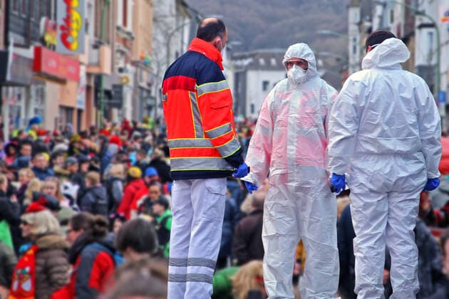 Danger of infection at carnival time PHOTOMONTAGE Increased risk of infection by the delta variant of the coronavirus at carnival events with countless people North Rhine-Westphalia Germany