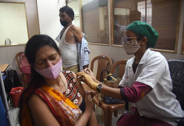 MUMBAI, INDIA - NOVEMBER 11: Beneficiaries get inoculated against Covid-19 at Maratha Mandir s Babasaheb Gawde Hospital, Vile Parle, on November 11, 2021 in Mumbai, India. (Photo by Vijay Bate Hindustan Times ) Daily Life Amid Coronavirus Pandemic In India