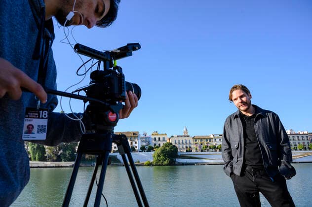 Spain: Final stretch of the 18th Seville Film Festival Daniel Brühl (Right) gives an interview during a photocall in the Seville Film Festival a side the Gualdalquivir river in November 12th, 2021. Seville Seville Spain Copyright: ÁngelxGarcía