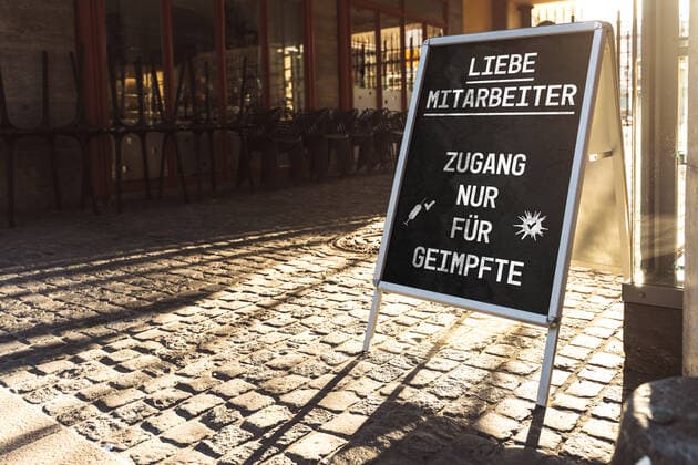 Bavaria, Germany - 13 November 2021: Access only for vaccinated employees, mandatory vaccination in the workplace, Covid-19 Dear employees Access only for vaccinated sign