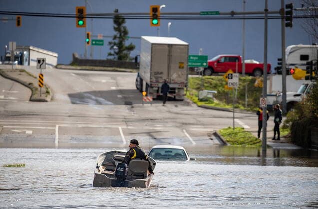 November 16, 2021, ABBOTSFORD, BC, CANADA: A volunteer operates a boat while rescuing people stranded due to floodwaters in Abbotsford, B.C., on Tuesday, November 16, 2021. ABBOTSFORD CANADA  - ZUMAc35_ 20211116_zaf_c35_053 Copyright: xDarrylxDyckx