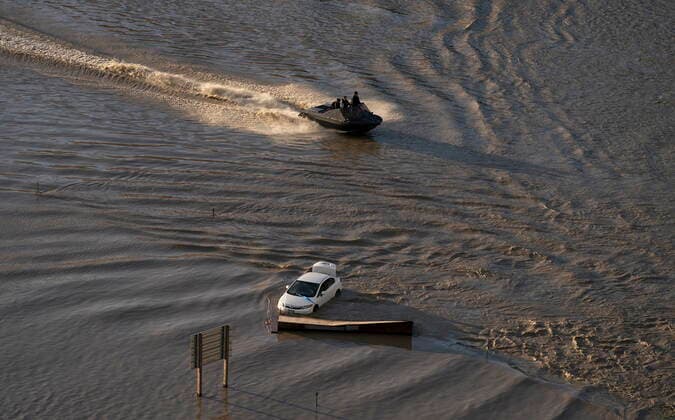 November 16, 2021, ABBOTSFORD, BC, Canada: A boat speeds along a flooded highway 1 in Abbotsford, B.C., Tuesday, Nov. 16, 2021. ABBOTSFORD Canada  - ZUMAc35_ 20211116_zaf_c35_100 Copyright: xJonathanxHaywardx