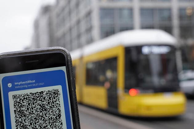 Symbol photo vaccination proof in the public local traffic Digital vaccination proof beside streetcar in Berlin, symbol picture 2G, 3G obligation, vaccination obligation for Corona vaccination in the OEPNV, public local traffic and or in the public means of transport