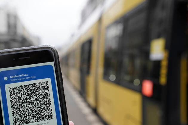 Symbol photo vaccination proof in the public local traffic Digital vaccination proof beside streetcar in Berlin, symbol picture 2G, 3G obligation, vaccination obligation for Corona vaccination in the OEPNV, public local traffic and or in the public means of transport