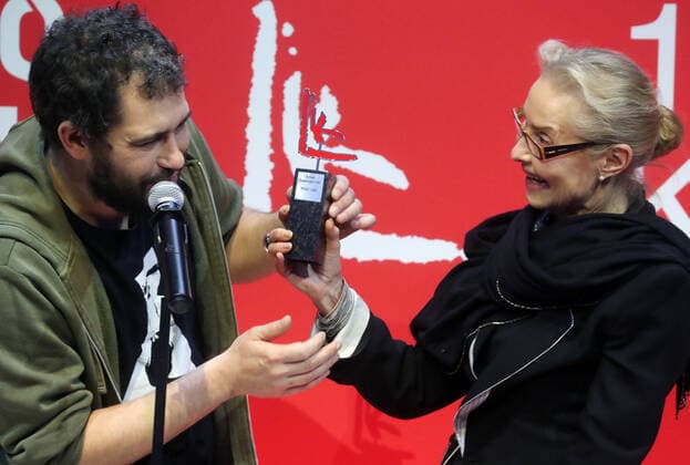 MOSCOW, RUSSIA - NOVEMBER 17, 2021: Olga Sviblova (R), director of the Multimedia Art Museum, presents a prize to Andrei Kuzkin, winner of the Project of the Year nomination for his Prayers and Heroes installation, during the 2021 Kandinsky Prize award ceremony at the Museum of Modern Art. Sergei Fadeichev TASS  TS1183FC
