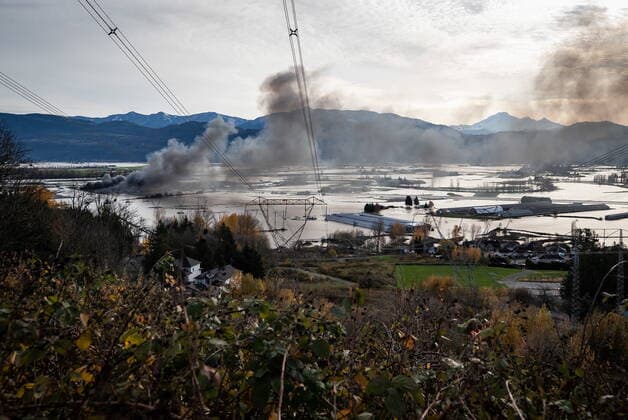 November 17, 2021, ABBOTSFORD, BC, CANADA: Recreational vehicles and trucks burn during a fire at a business surrounded by floodwaters in Abbotsford, B.C., on Wednesday, November 17, 2021. ABBOTSFORD CANADA  - ZUMAc35_ 20211117_zaf_c35_038 Copyright: xDarrylxDyckx