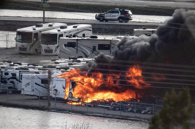 November 17, 2021, ABBOTSFORD, BC, CANADA: Recreational vehicles burn during a fire at a business surrounded by floodwaters in Abbotsford, B.C., on Wednesday, November 17, 2021. ABBOTSFORD CANADA  - ZUMAc35_ 20211117_zaf_c35_044 Copyright: xDarrylxDyckx