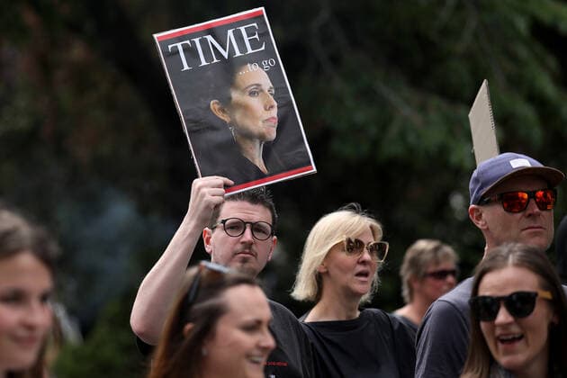 New Zealand Protesters March Against COVID-19 Restrictions A member of the public holds a picture of the Prime Minister Jacinda Ardern during a protest march organized by Freedom and Rights Coalition to demand an end to Covid-19 restrictions and mandatory vaccination in Christchurch, New Zealand on November 20, 2021. Ninety-one percent of New Zealanders over the age of 12 have had their first dose, and 82 per cent are fully vaccinated. So far the country has reported 9,652 cases and 38 deaths by November 19. Christchurch New Zealand  Copyright: xSankaxVidanagamax vidanagama-notitle211120_npVbO