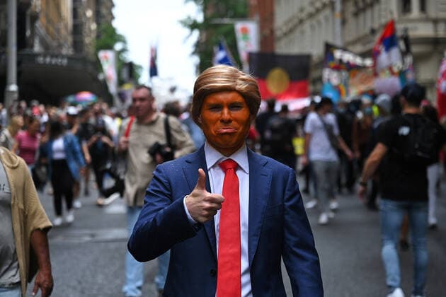 COVID19 FREEDOM RALLY SYDNEY, A man dressed up as former US president Donald Trump participates in The Worldwide Rally for Freedom protest against mandatory vaccinations and lockdown measures in Sydney, Saturday, November 20, 2021. The Worldwide Rally for Freedom is a day of rallies purportedly for freedom across many countries, including Australia. ( NO ARCHIVING, EDITORIAL USE ONLY, NO USE IN BOOKS WITHOUT CONSENT SYDNEY NSW AUSTRALIA  Copyright: xSTEVENxSAPHOREx 20211120001598415293