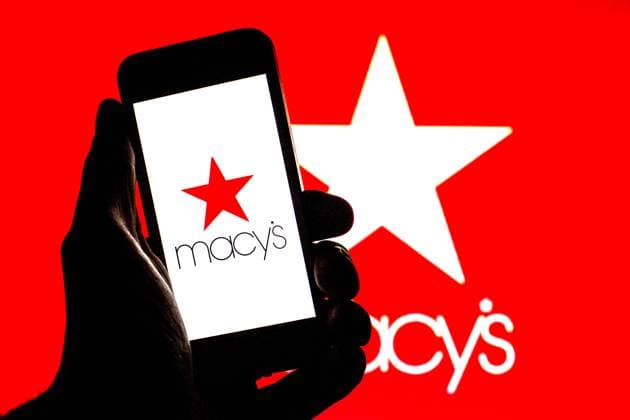 November 16, 2021, Barcelona, Catalonia, Spain: In this photo illustration, a Macy s logo is seen on a smartphone screen with a Macy s logo in the background. Barcelona Spain - ZUMAd159 20211116_zia_d159_023 Copyright: xThiagoxPrudenciox