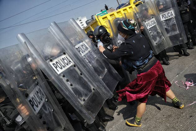 Transgender Community Protest Against Transphobia And Transfemicides MEXICO CITY, MEXICO - NOVEMBER 20, 2021: A transgender community member confronts riot police during a demonstration against transphobia and demanded justice for the trans femicides during the commemoration the transgender remembrance day. On November 20, 2021 in Mexico City, Mexico. (Photo by Fernanda Rojas Eyepix Group) Copyright: xFernandaxRojasx EYEPIXGROUP_FR_20112021_19832