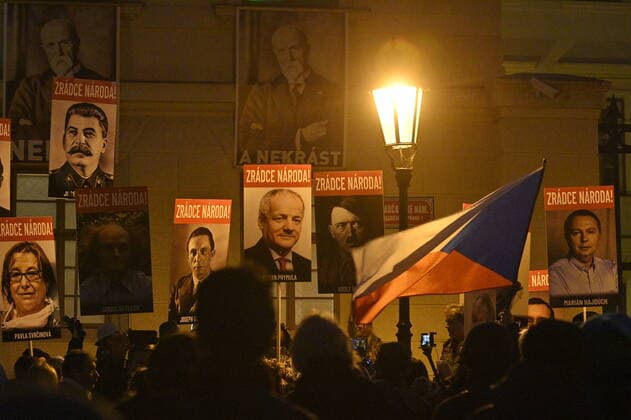People joined a march against the government COVID-19 restrictions organised by the We Will Open Czechia-Dog Croaked movement in Prague, Czech Republic, November 22, 2021. (CTKxPhoto MichalxKamaryt) CTKPhotoP2021112207040 
