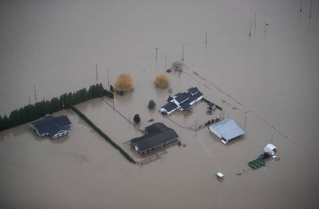 November 22, 2021, ABBOTSFORD, BC, CANADA: Houses and barns are surrounded by floodwaters on a farm in Abbotsford, B.C., on Monday, November 22, 2021. ABBOTSFORD CANADA  - ZUMAc35_ 20211122_zaf_c35_120 Copyright: xDarrylxDyckx