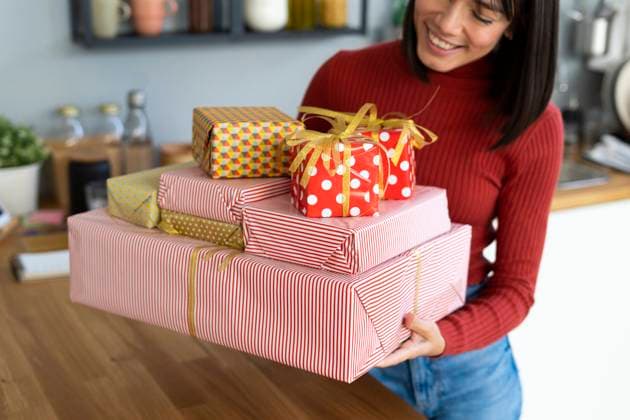 Young freelancer carrying gift boxes at home model released property released, GIOF14070