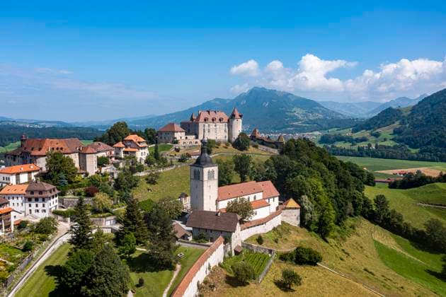 Switzerland, Canton of Fribourg, Gruyeres, Aerial view of Gruyeres Castle in summer RUNF04672