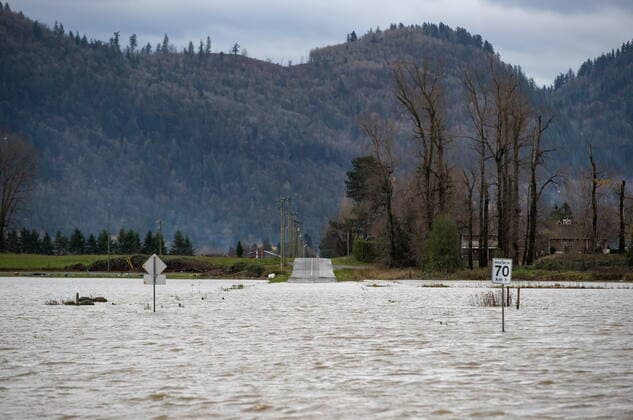 November 23, 2021, ABBOTSFORD, BC, Canada: Floodwaters cover a road that runs through farmland in Abbotsford, B.C., Tuesday, Nov. 23, 2021. ABBOTSFORD Canada  - ZUMAc35_ 20211123_zaf_c35_211 Copyright: xDarrylxDyckx