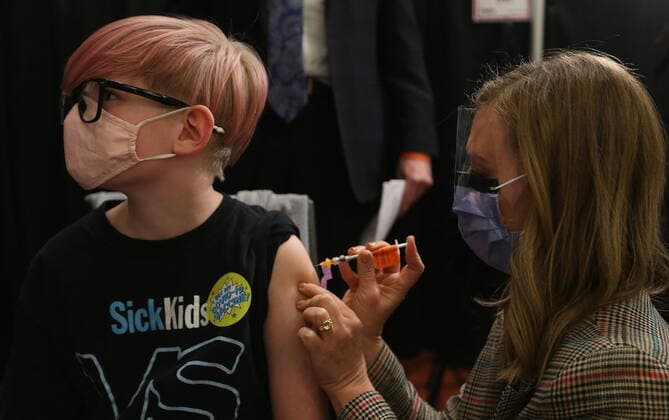 November 23, 2021, Toronto, on, Canada: Children who are part of the Hospital for Sick Children family between the ages of 5 and 11 years of age are some of the first to get vaccinated for COVID-19 at the Metro Toronto Convention Centre, in Toronto, Tuesday, Nov. 23, 2021. Toronto Canada  - ZUMAc35_ 20211123_zaf_c35_276 Copyright: xStevexRussellx