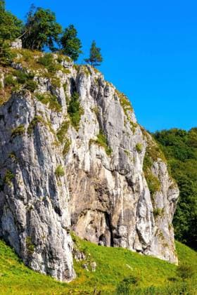 Crown rocks - Skaly Koronne - Jurassic limestone mountain massif with Glove Rock - Rekawica - in Pradnik creek valley of Cracow-Czestochowa upland in Lesser Poland  BEW1DDC3F33