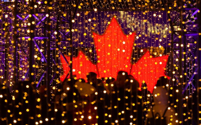 (211128) -- TORONTO, Nov. 28, 2021 -- People visit the 2021 Cavalcade of Lights in Toronto, Canada, Nov. 27, 2021. The annual light show in Toronto kicked off on Saturday and will last until Jan. 2, 2022. (Photo by Xinhua) CANADA-TORONTO-LIGHT SHOW ZouxZheng 